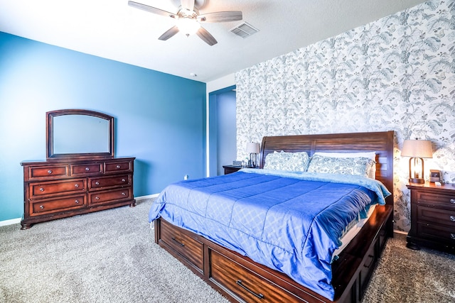 bedroom with baseboards, visible vents, carpet flooring, and wallpapered walls