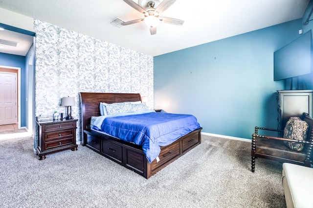 bedroom featuring baseboards, visible vents, carpet flooring, and wallpapered walls