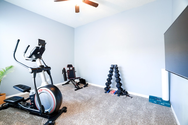 workout area with carpet floors, a ceiling fan, and baseboards