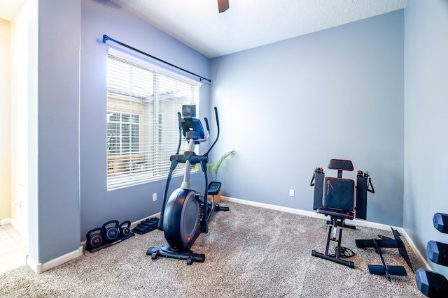 workout area with carpet floors, baseboards, and a ceiling fan