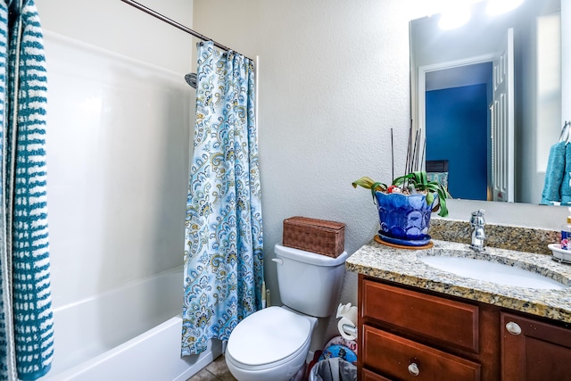 full bath featuring toilet, a textured wall, shower / bath combo with shower curtain, and vanity