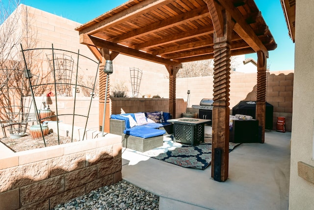 view of patio / terrace with an outdoor living space with a fire pit, fence, and area for grilling