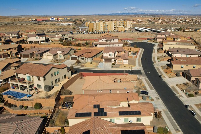 birds eye view of property with a residential view