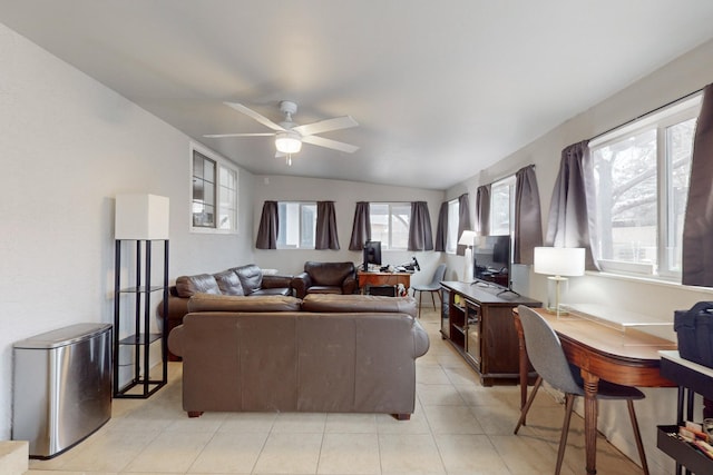 living room featuring ceiling fan and lofted ceiling