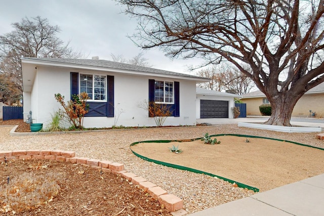 ranch-style home with a garage