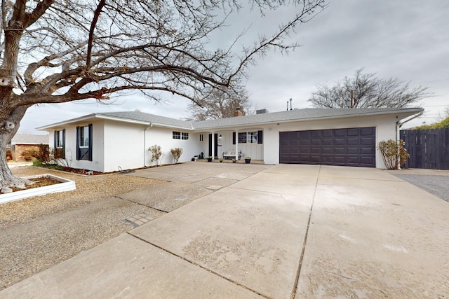 ranch-style home featuring a garage