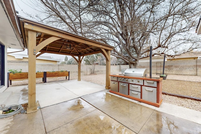 view of patio / terrace featuring a gazebo and area for grilling