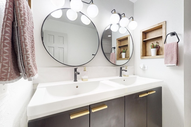 bathroom with vanity and built in shelves