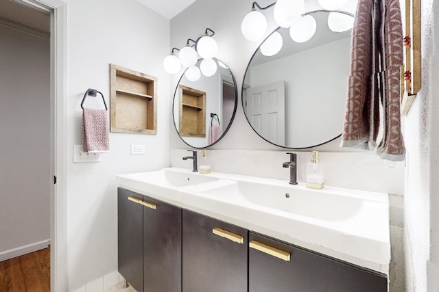 bathroom with hardwood / wood-style floors and vanity