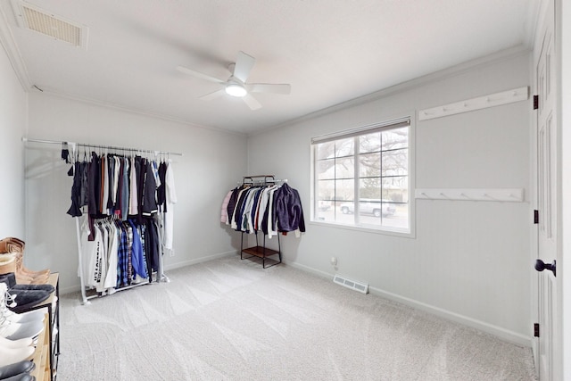 spacious closet featuring light carpet and ceiling fan