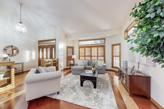 living room featuring light hardwood / wood-style flooring and an inviting chandelier