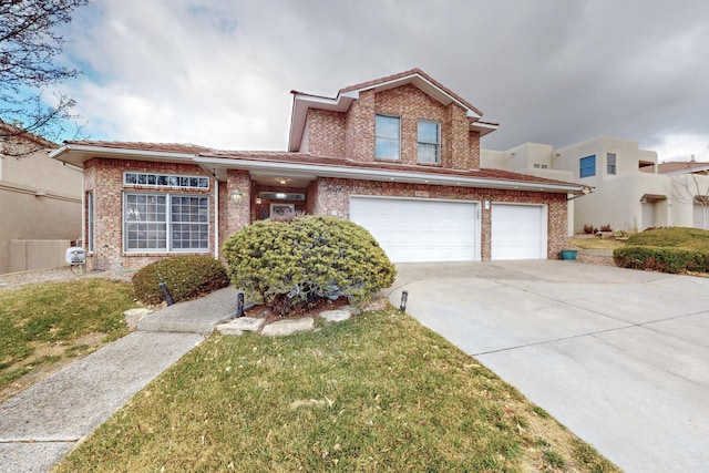 view of property featuring a front lawn and a garage