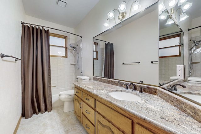 full bathroom featuring toilet, tile patterned flooring, shower / bath combination with curtain, and vanity