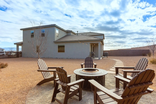 view of patio / terrace featuring an outdoor fire pit