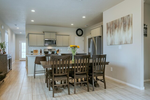 dining room with a textured ceiling