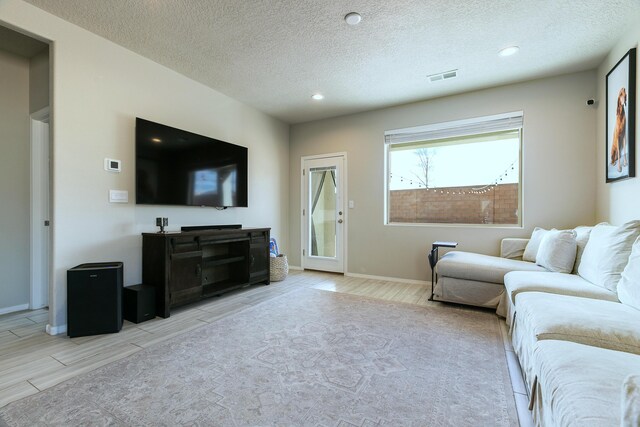 living room with a textured ceiling