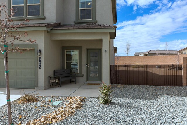 view of exterior entry featuring a garage