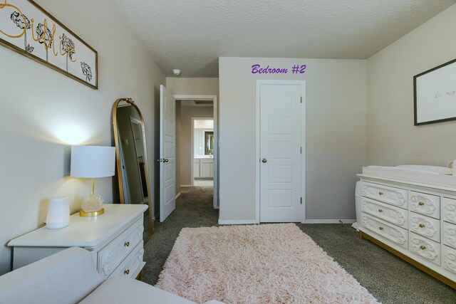 carpeted bedroom with a textured ceiling