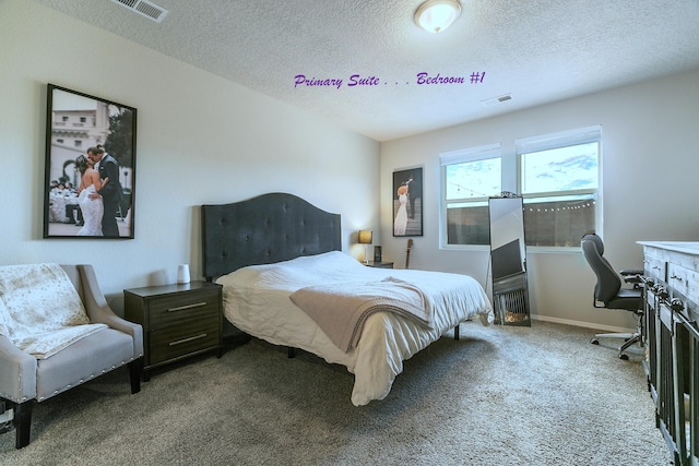 carpeted bedroom featuring a textured ceiling