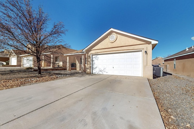 ranch-style home featuring a garage