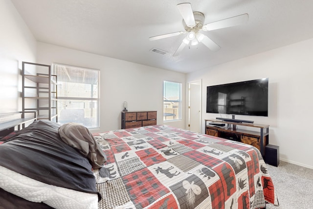 carpeted bedroom featuring ceiling fan