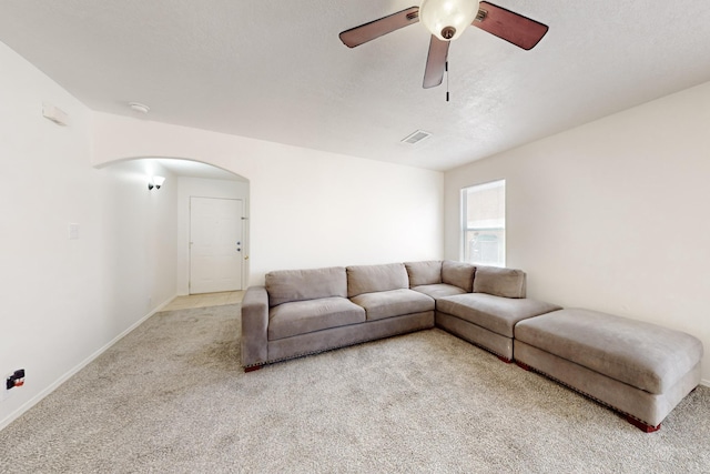 living room with light carpet and ceiling fan