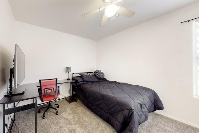 bedroom featuring ceiling fan and light colored carpet