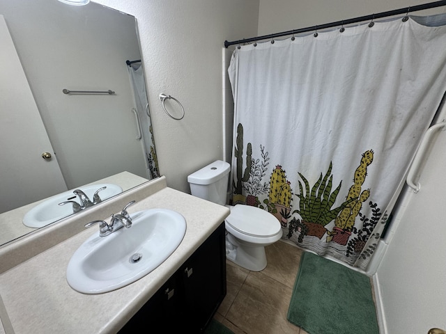 bathroom with vanity, toilet, and walk in shower