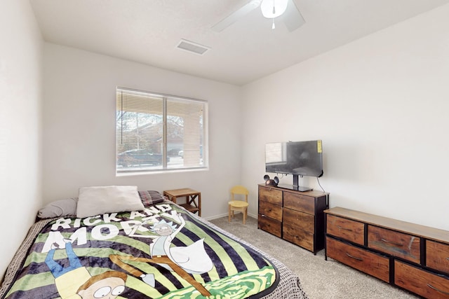 bedroom featuring ceiling fan and light carpet