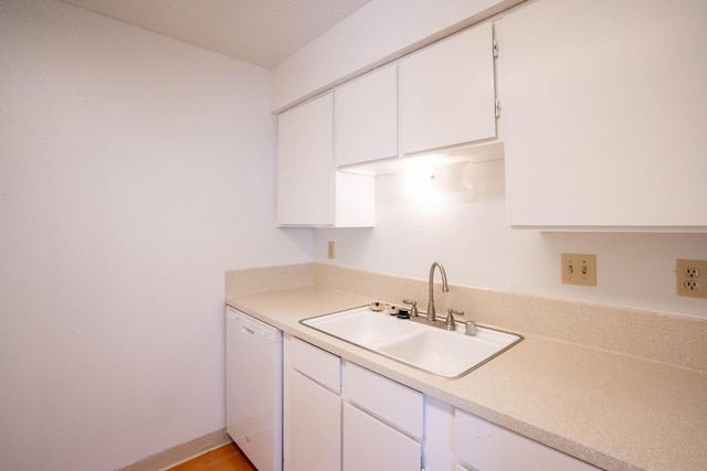 kitchen with white cabinets, sink, and dishwasher