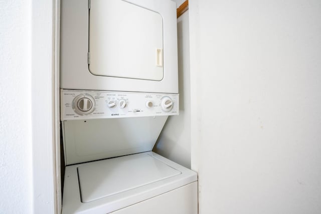 laundry room featuring stacked washing maching and dryer