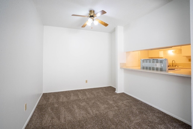 3841 Montgomery Blvd NE Unit 836, Albuquerque, NM 87109 - carpeted spare room featuring ceiling fan, a sink, and baseboards