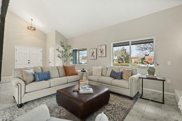 living room featuring lofted ceiling