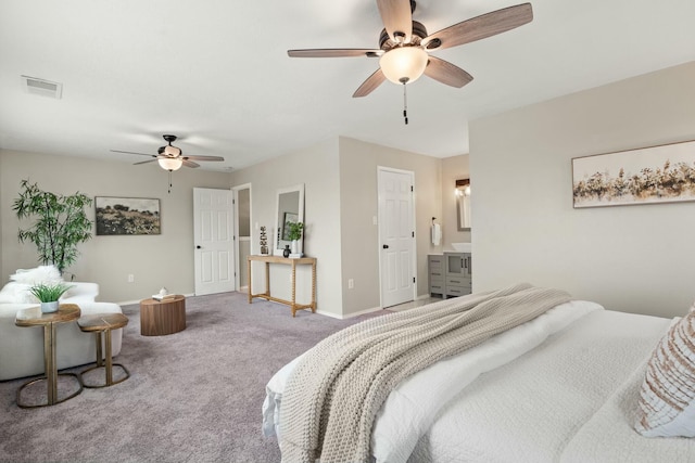 bedroom featuring ensuite bathroom, ceiling fan, and carpet flooring