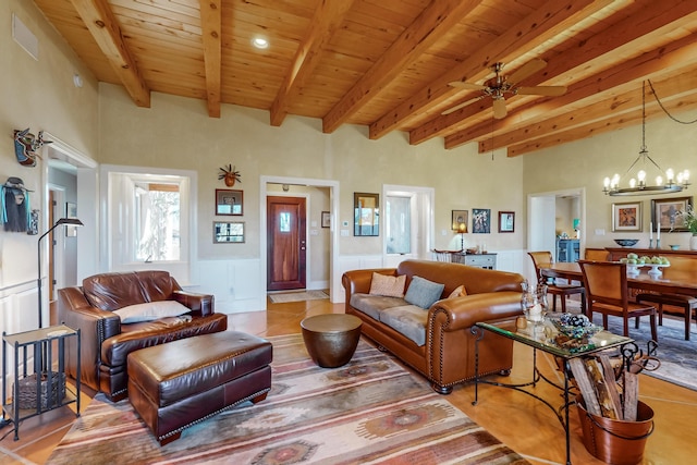 living room with ceiling fan with notable chandelier, tile patterned flooring, wood ceiling, and beam ceiling