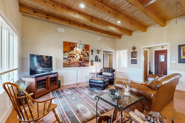 living room featuring wooden ceiling, tile patterned floors, and beam ceiling