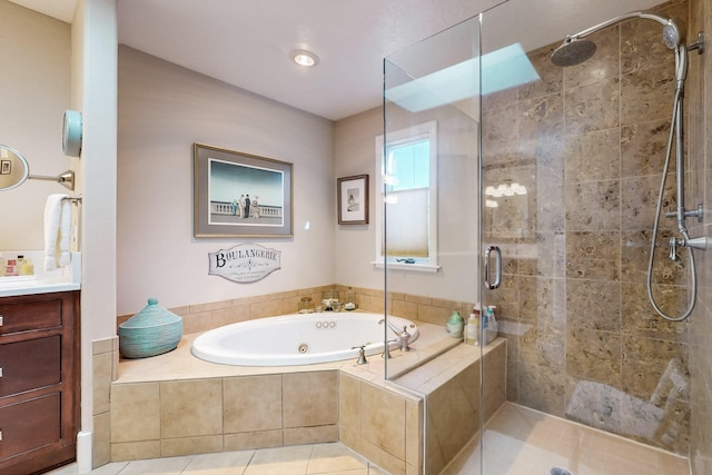 bathroom with tile patterned flooring, vanity, and shower with separate bathtub