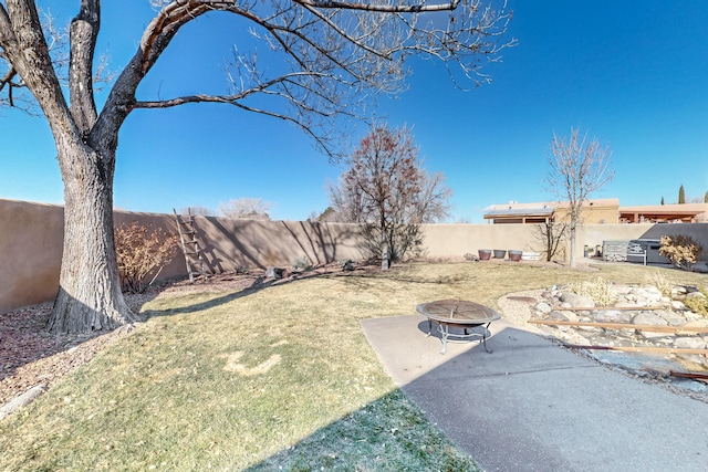 view of yard with a patio area and a fire pit