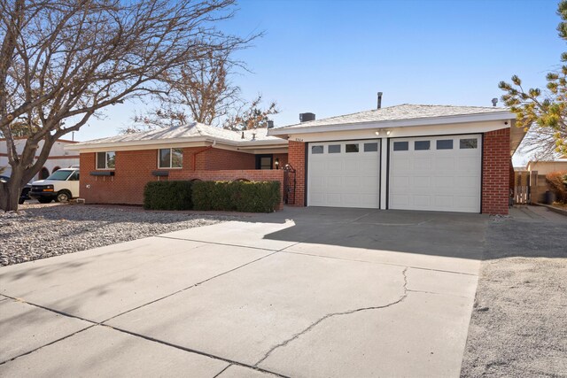 ranch-style home with a garage