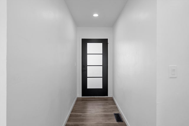 doorway to outside with dark hardwood / wood-style flooring