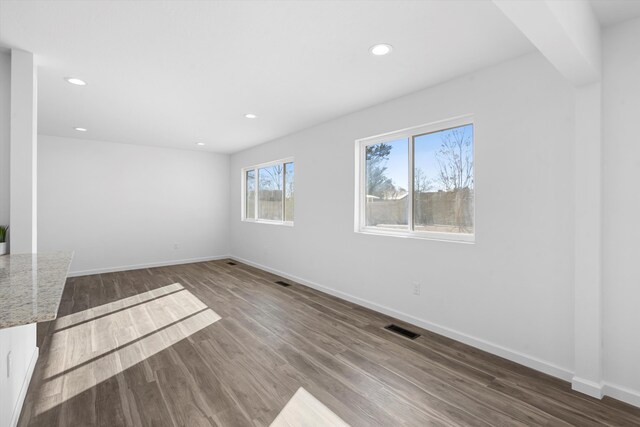 unfurnished living room featuring ceiling fan, french doors, a fireplace, and wood-type flooring