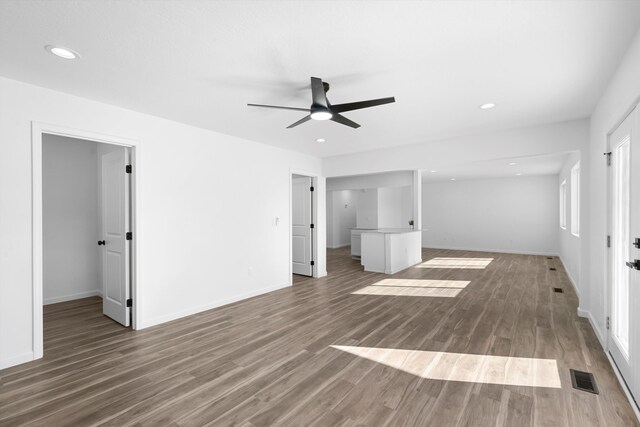 unfurnished room with wood-type flooring