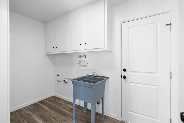 kitchen with stainless steel appliances, sink, white cabinets, light hardwood / wood-style flooring, and light stone countertops