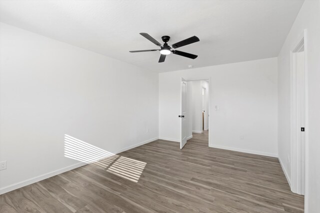 walk in closet with dark hardwood / wood-style flooring