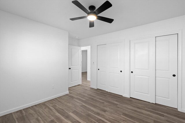 unfurnished room featuring ceiling fan and dark hardwood / wood-style flooring