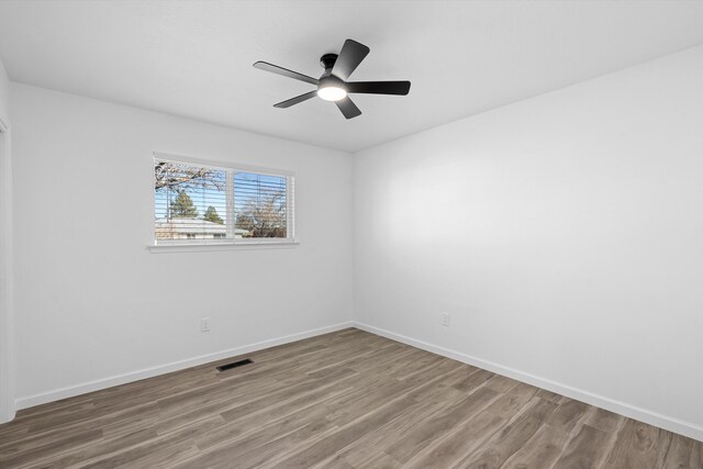 unfurnished bedroom with ceiling fan, light hardwood / wood-style flooring, and a closet