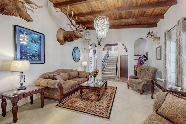 carpeted living room with wooden ceiling, a chandelier, and beamed ceiling