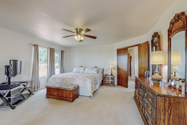 bedroom featuring ceiling fan and light carpet