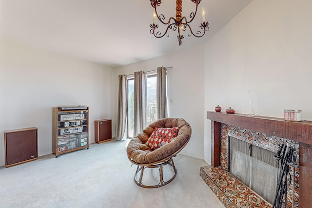 sitting room featuring a high end fireplace, light carpet, and a notable chandelier