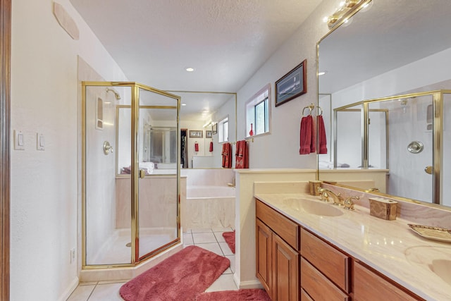 bathroom with tile patterned floors, vanity, and independent shower and bath